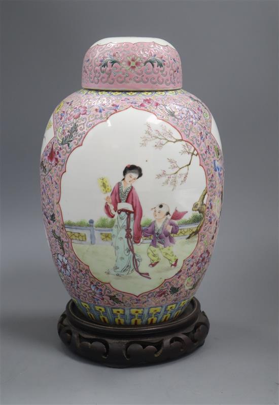 A Chinese famille rose lidded jar and stand height 26cm excluding stand